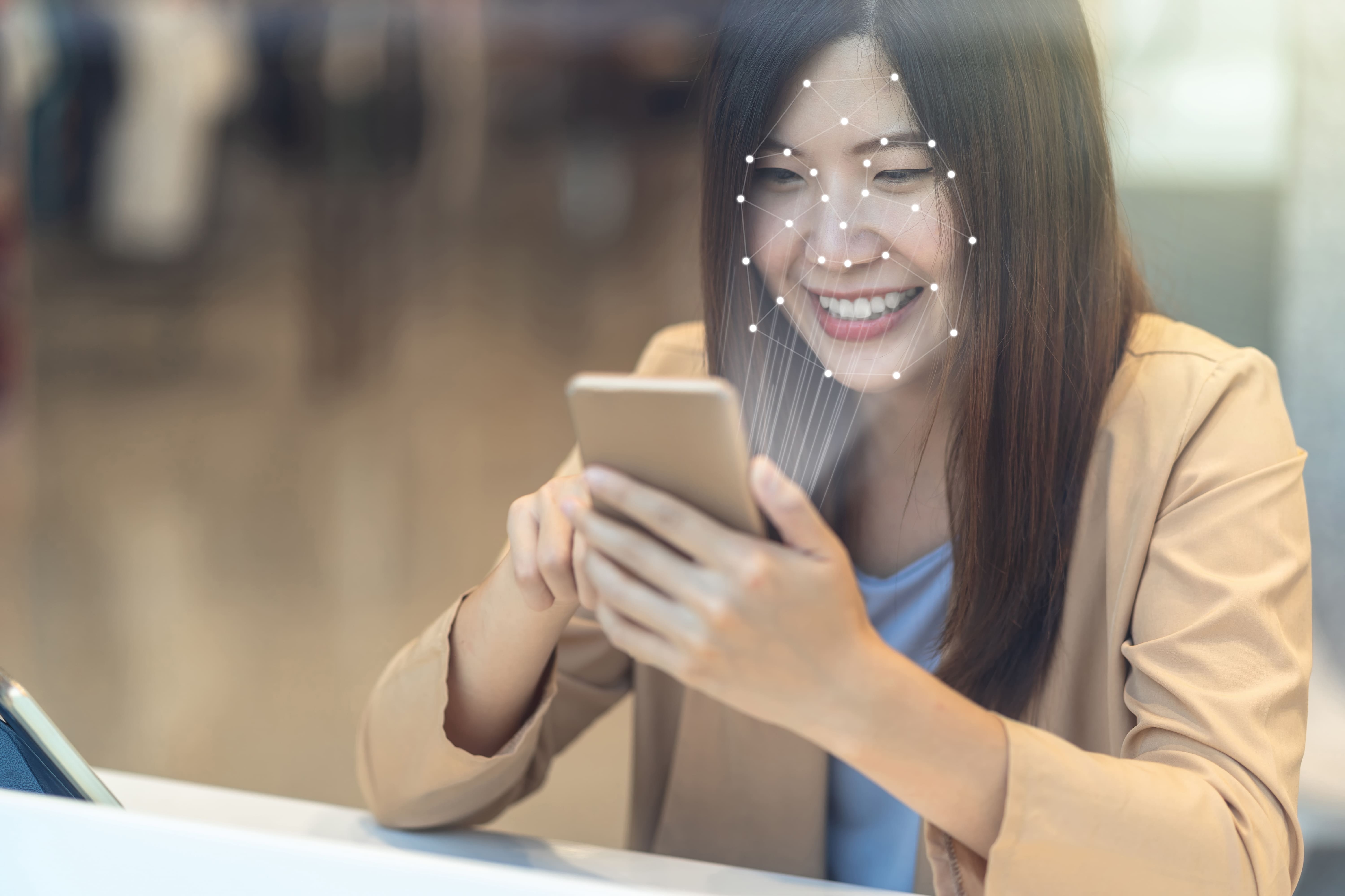 Asian woman smiling, representing identity verification user